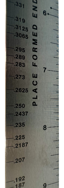 Spring Gauge Ruler. Used to determine wire size when replacing broken springs - closeup